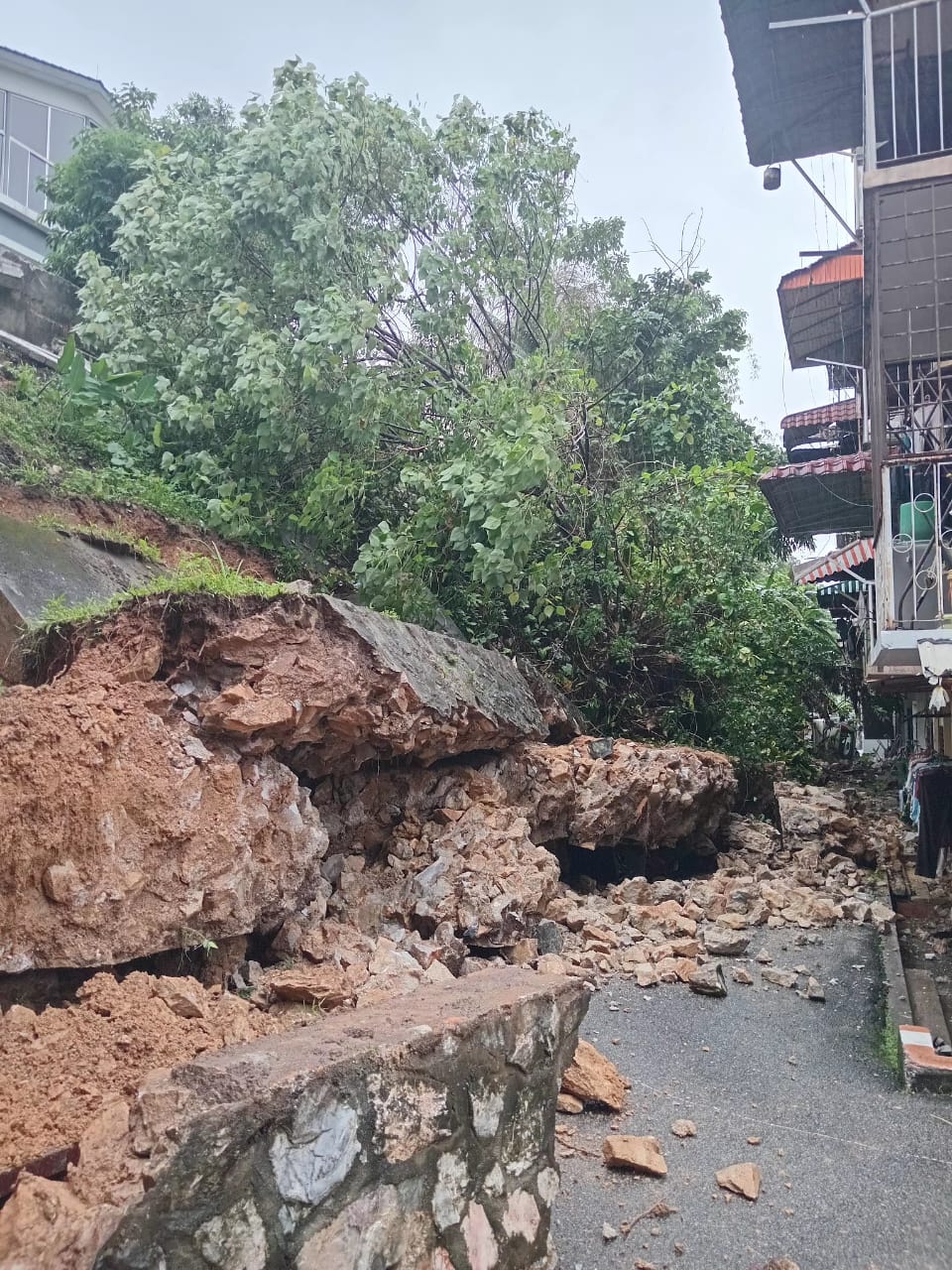 Curated visual reference: Rain Adchieved Apartment Complexes Reference: Evacuation Ordered After Incessant Rain Causes Landslide Near Apartment