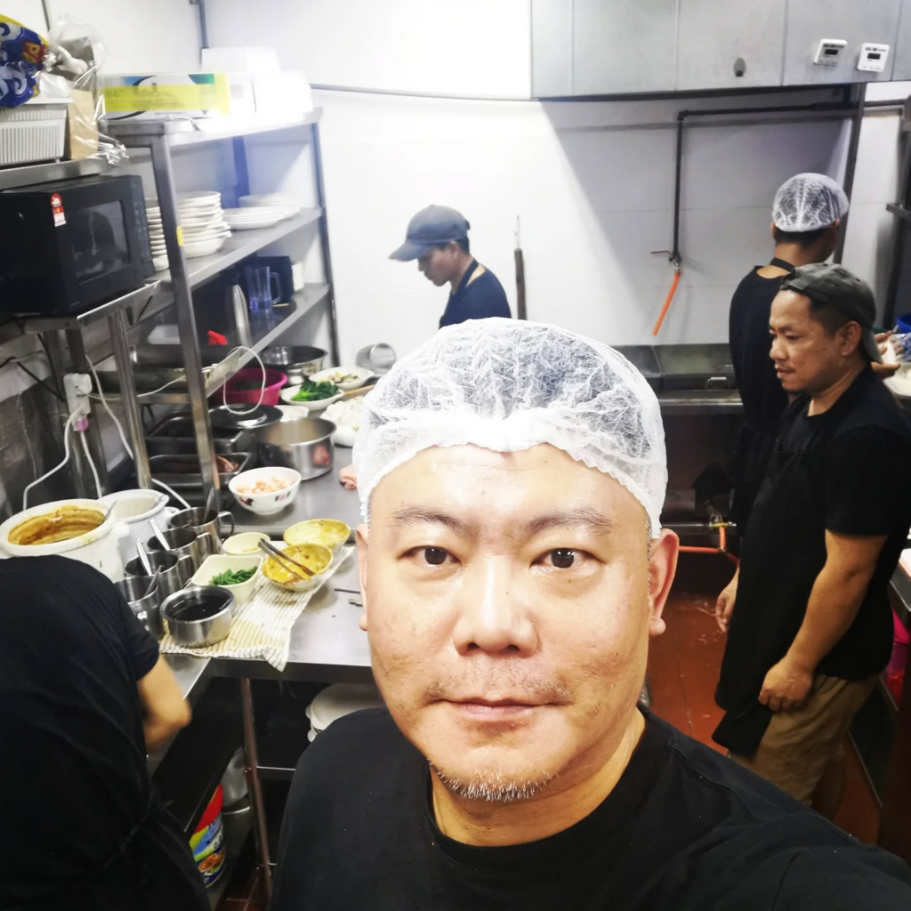 Ipoh Ipoh Cafe owner cum chef with his staff in the kitchen.