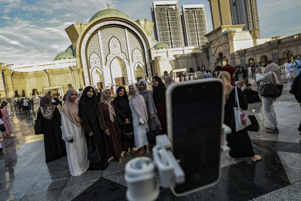 Muslims attend Eid al-Fitr prayers in Kuala Lumpur.
