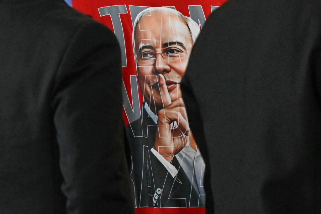 A supporter's t-shirt bearing an image of former prime minister Najib Razak hushing, during his 1MDB trial at the Palace of Justice.