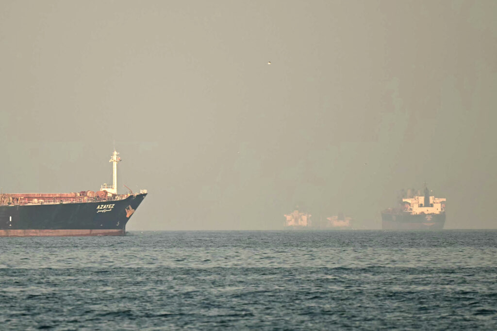 Cargo ships and tankers are seen off coast city of Fujairah, in the Strait of Hormuz in the northern Emirate