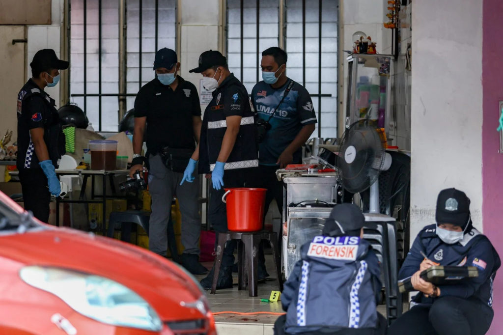 Police at the scene of the shooting incident at Taman Kota Jaya, Kota Tinggi