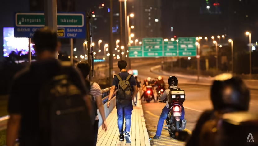 People walking towards Johor along the Causeway